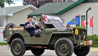 Survivor of World War II, Seaman Bill Jepps, rode in the 2025 Didsbury Elks Parade.  Two military vehicles by the Prairie Motor Brigade won Best Antique Open Class!