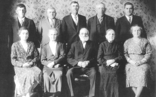 Record ID PIC1587210666. 1934 Photo - First Settlers of Didsbury. Top Row: Ivan S. Weber, Manassah Weber, Abner Hunsperger, Allen Hunsperger, Ed Weber, Front Row: Mrs. Fred Budgeon, Mrs. Abner Hunsperger, Sam Troyer, Mrs. Ephraim Shantz, Mrs. Alvin Hunsperger.