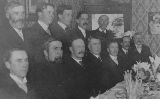 Record ID PIC1586088244. Didsbury Town Council, 1906. Back Row: School Board, N. Eby, Dr. Williams, Dr. Reid, H.E. Osmond, Mr. Vernon Front Row: Town Council, J.V. Berscht, Dave Shants, Mayor G.B. Sexsmith, H.B. Aikens, A.F. Maley, O.W. Hembling, W.H. Smith.